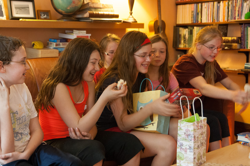 April 15, 2012<nbsp/> @<nbsp/> 14:10<br/><br/>opening gifts at the 'friends' party.  I'm not sure we can fit more people on the couch.